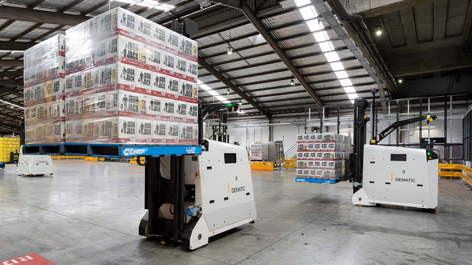 Multiple AGVs moving beverage pallets in warehouse Multiple AGVs moving beverage pallets in warehouse